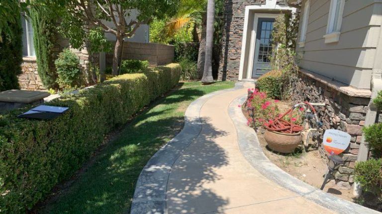 Compact backyard with planting, pathways, and defined outdoor areas