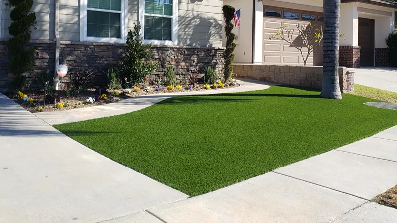Completed artificial turf installation in a residential yard