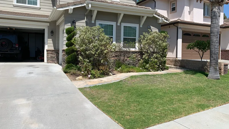 Residential yard before artificial turf installation