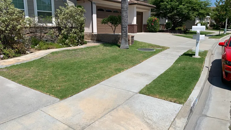 Original grass lawn before synthetic turf installation in Brea