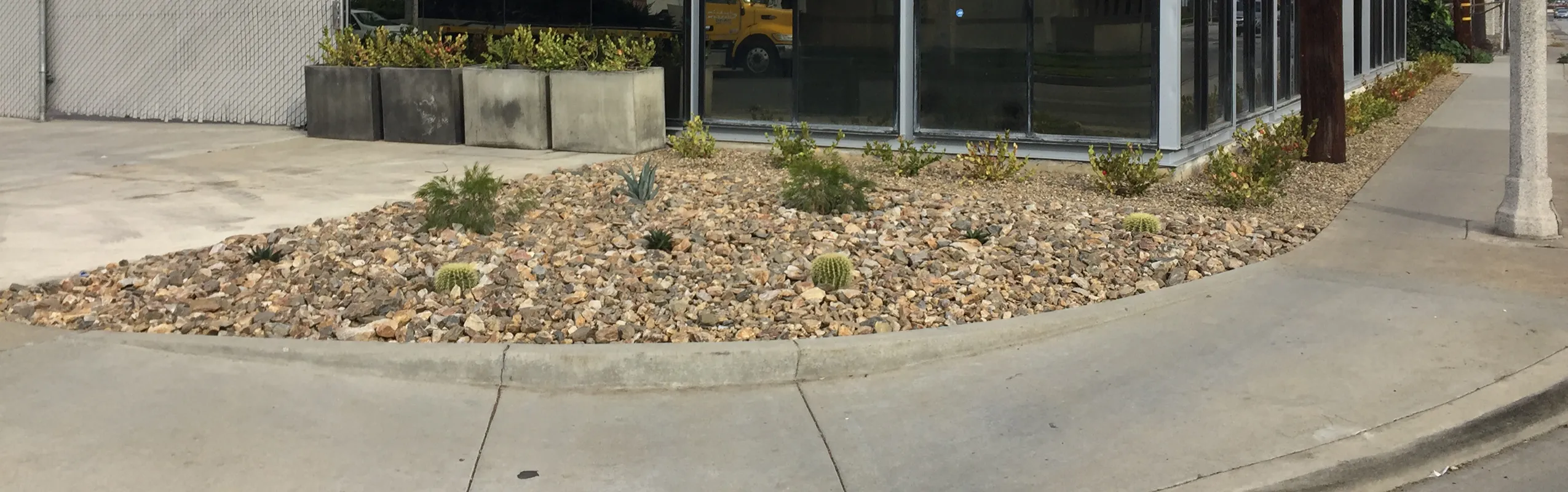 Residential landscape designed to manage drainage and surface water