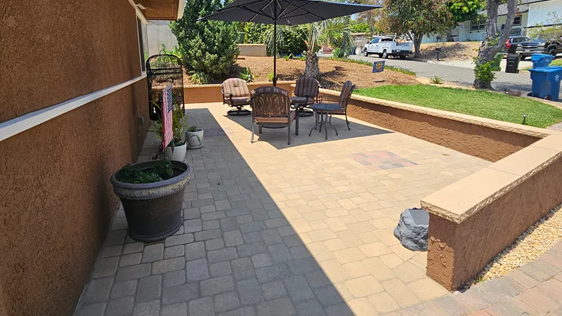 Completed residential hardscape installation with defined outdoor areas