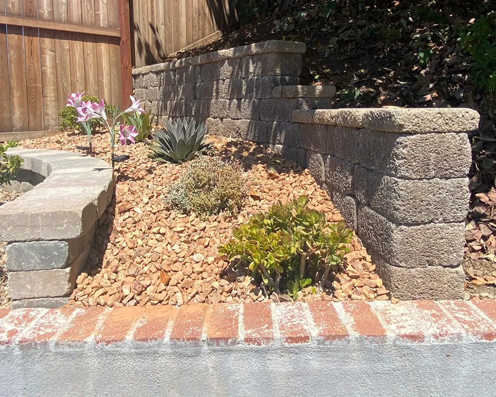Custom retaining wall integrated into a residential landscape