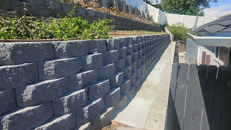 Completed retaining wall integrated into a residential landscape