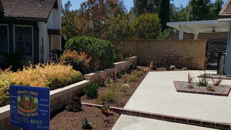 Front yard after the driveway expansion and synthetic turf installation in Yorba Linda