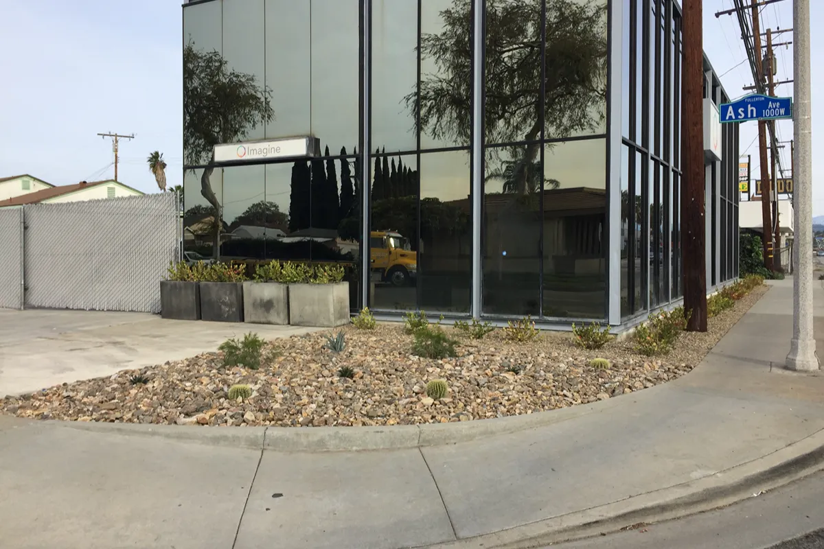 Front of the Fullerton business after desert planting and decorative rock installation